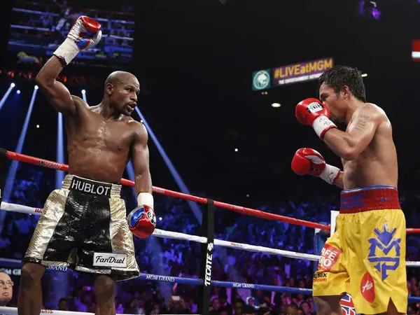 Floyd Mayweather has told Manny Pacquiao that he'd get his 'ass whooped' if the two shared a boxing ring again